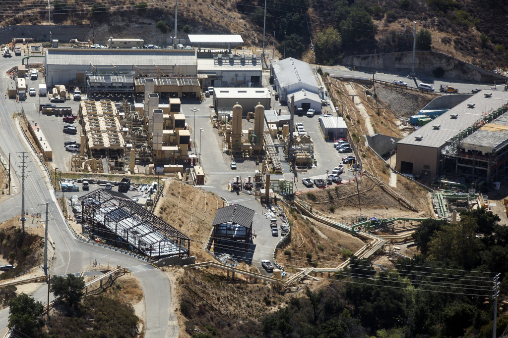 Aerial photo of a sprawling industrial facility, consisting of multiple buildings. 